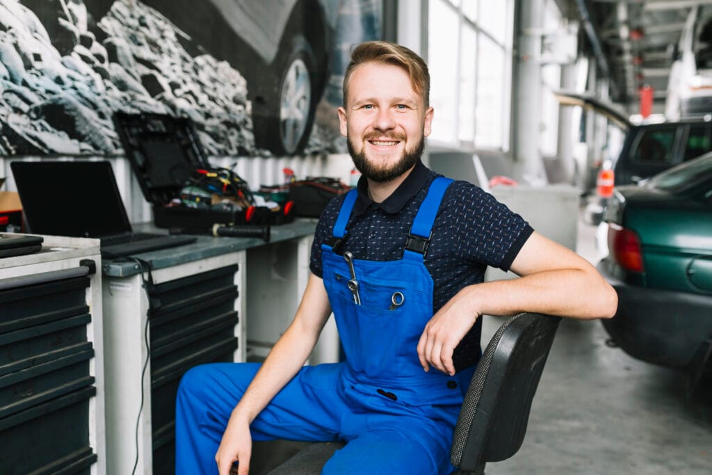 smiling repairmen workshop